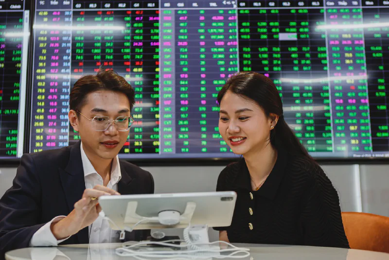 Investors monitoring stock market prices