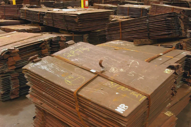 LME copper cathodes stacked high in a warehouse