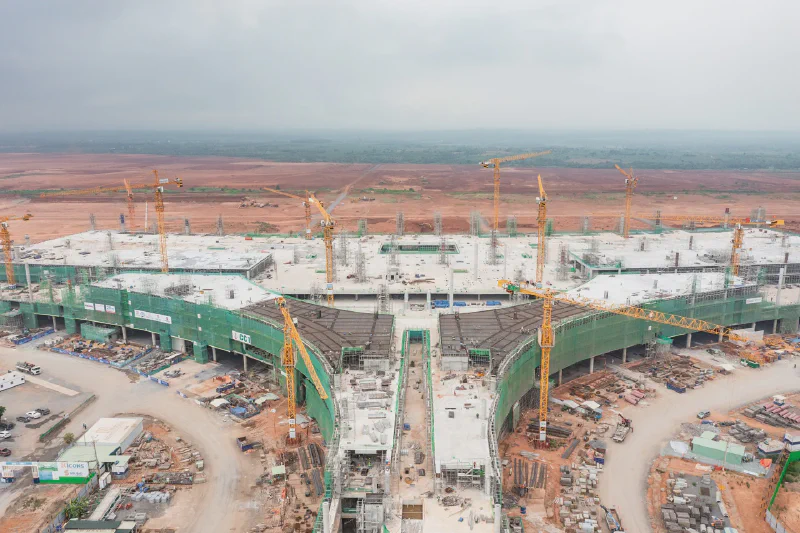 Long Thanh terminal under construction — the lotus-shaped steel roof frame taking shape