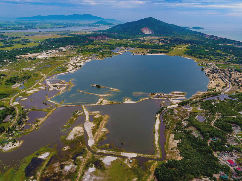Aerial view of the Thach Khe mine site, with the sea visible in the background