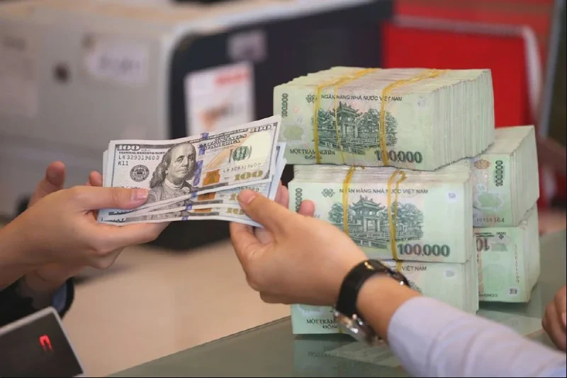 USD and Vietnamese dong at a bank exchange counter